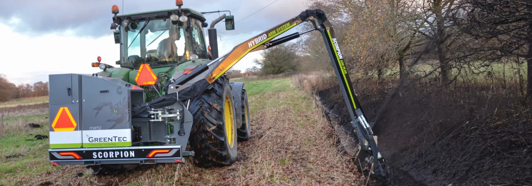 Ditch mowing performed with boom arm