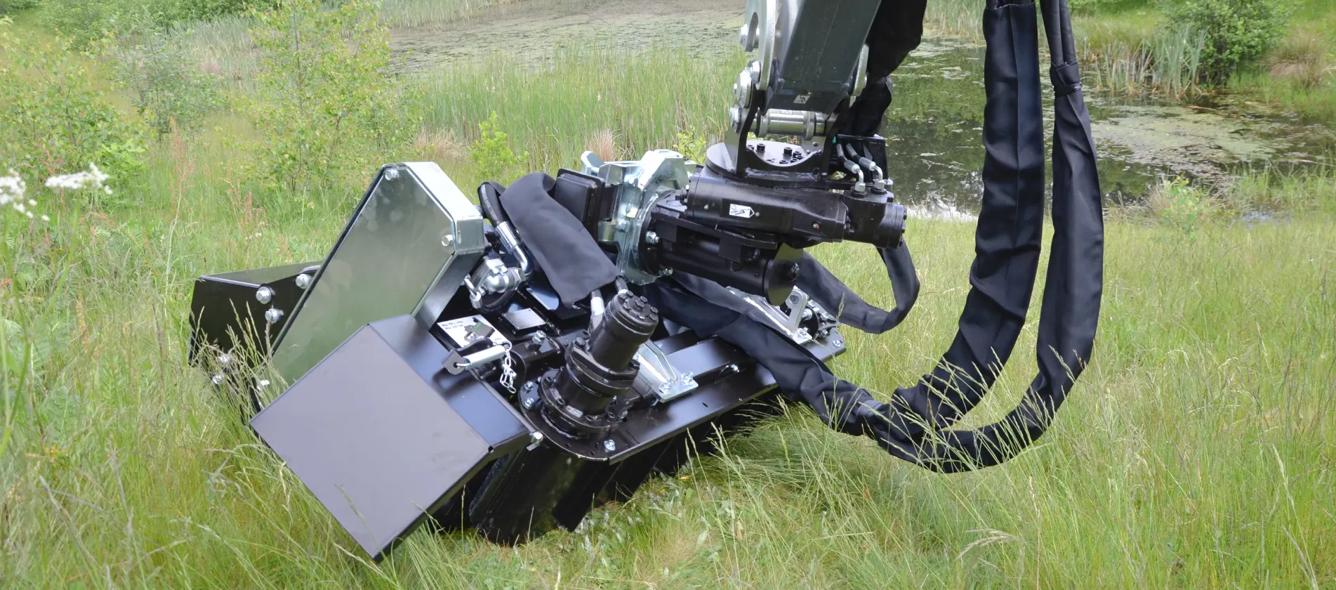 Flail mower for water streams and canals