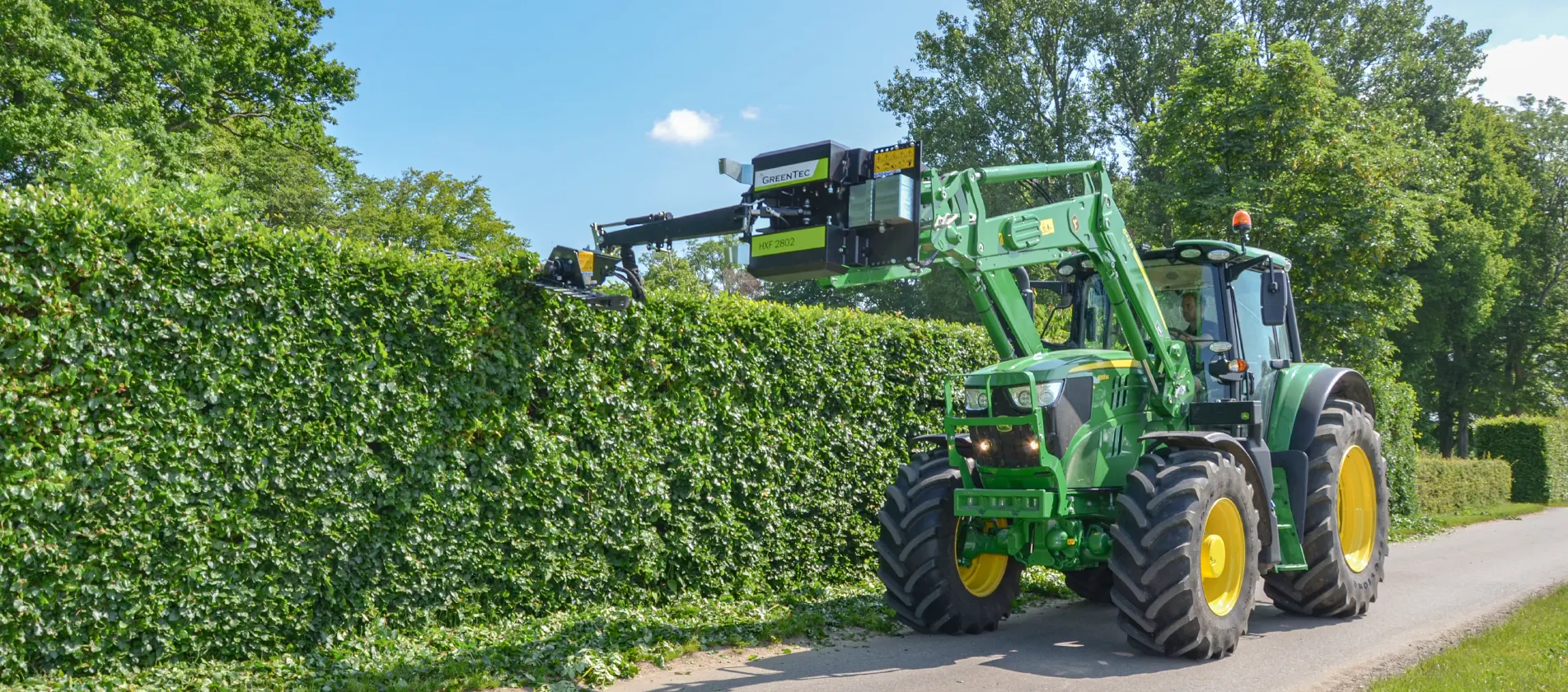 Front end loader attachment for hedge trimming