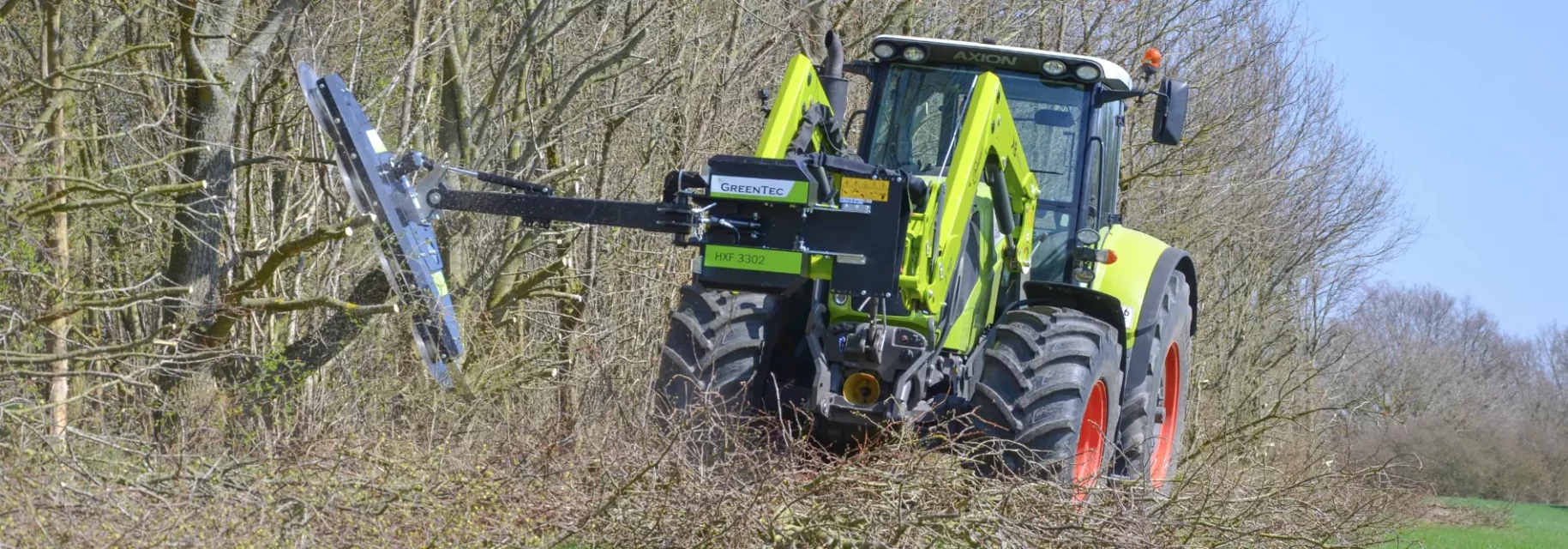 Saw attachment mounted on tractor