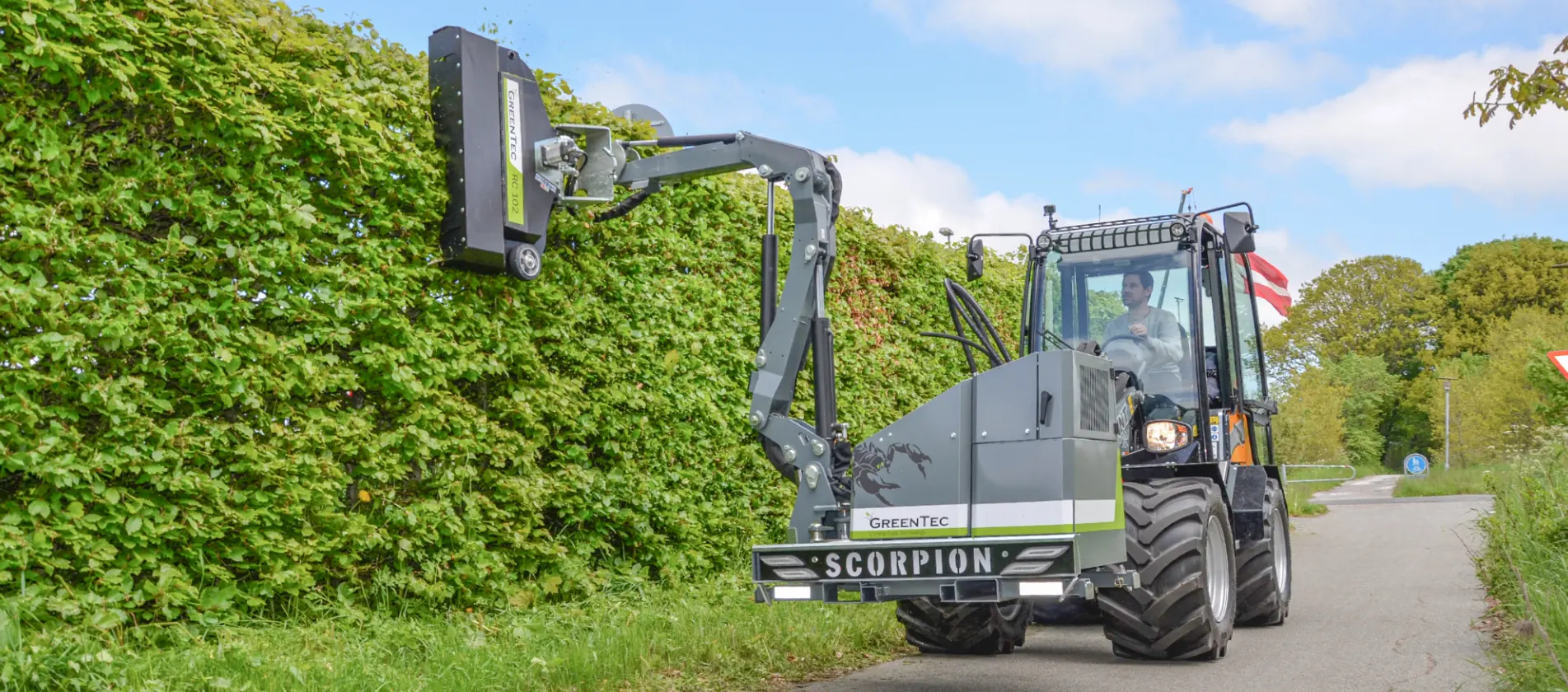 Hedge trimmer attachment for skid steer loader