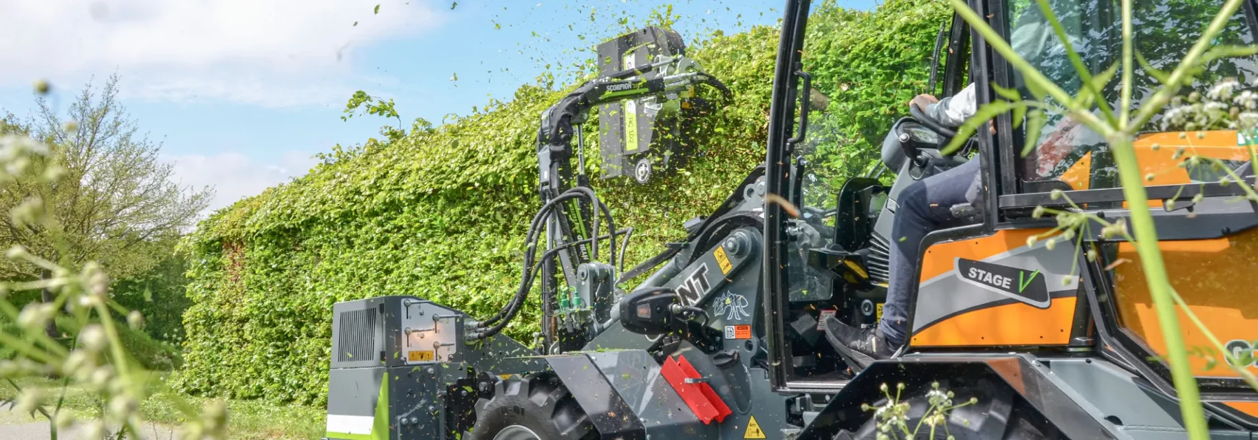 Hedge trimming with skid steer loader