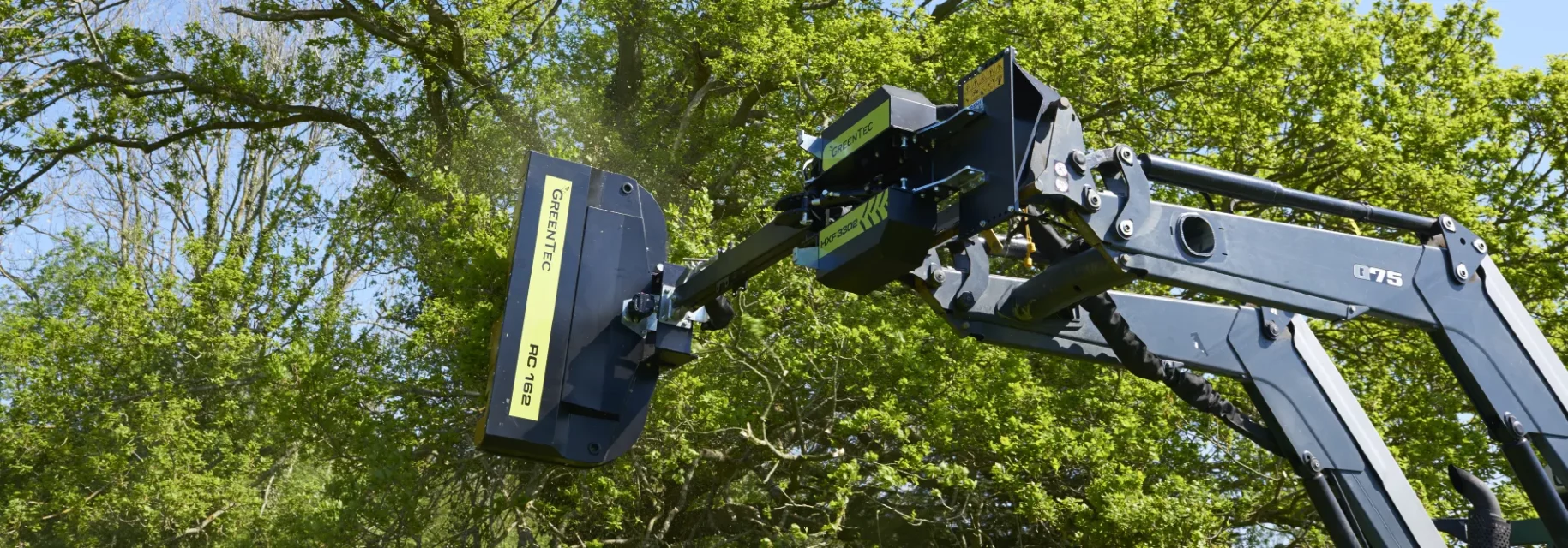 Hedge trimmer attached to front end loader