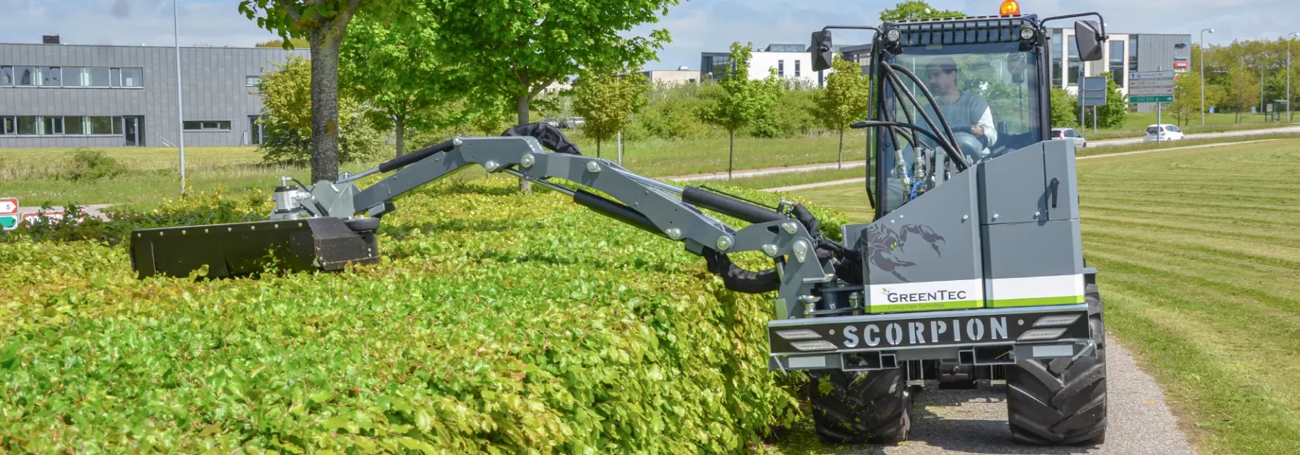 Front mounted boom mower on loader