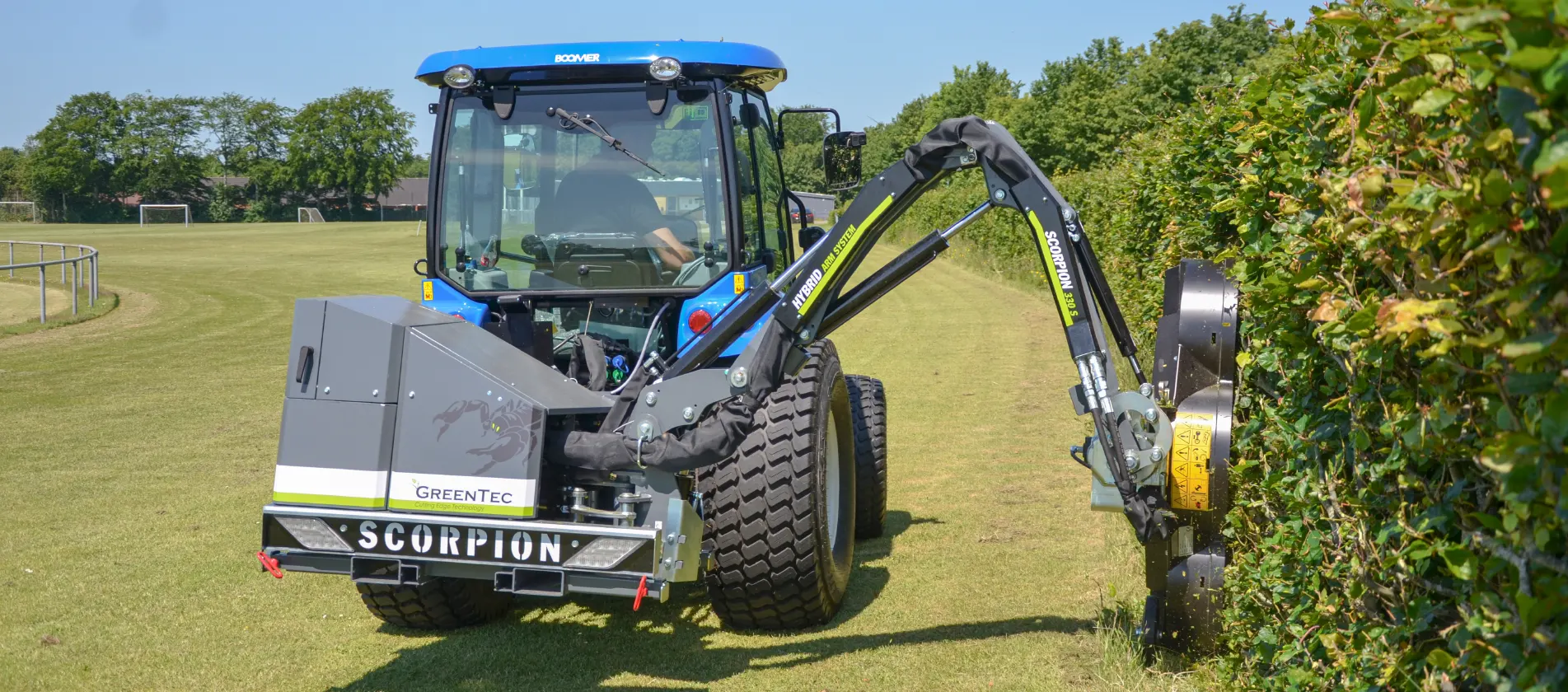 Reach mower with hedge trimming attachment