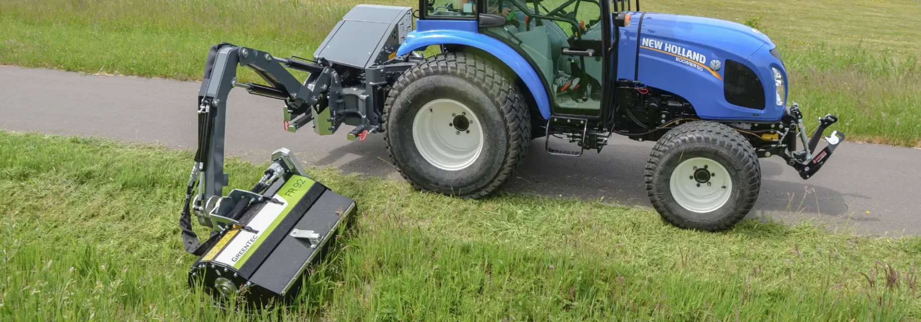 Roadside maintence with micro boom mower