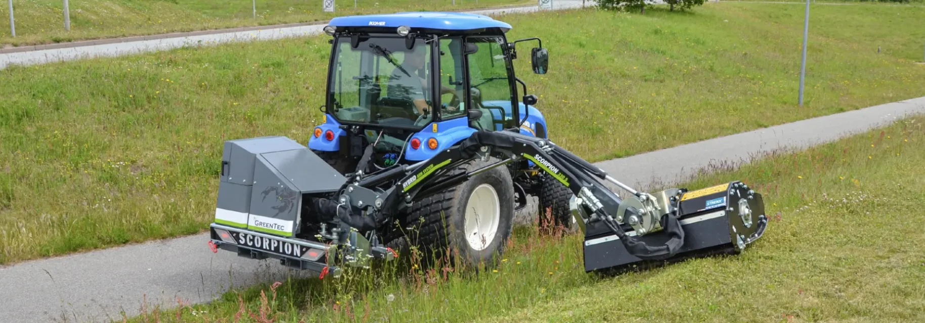 Maintenance of grass on slopes with reach mower