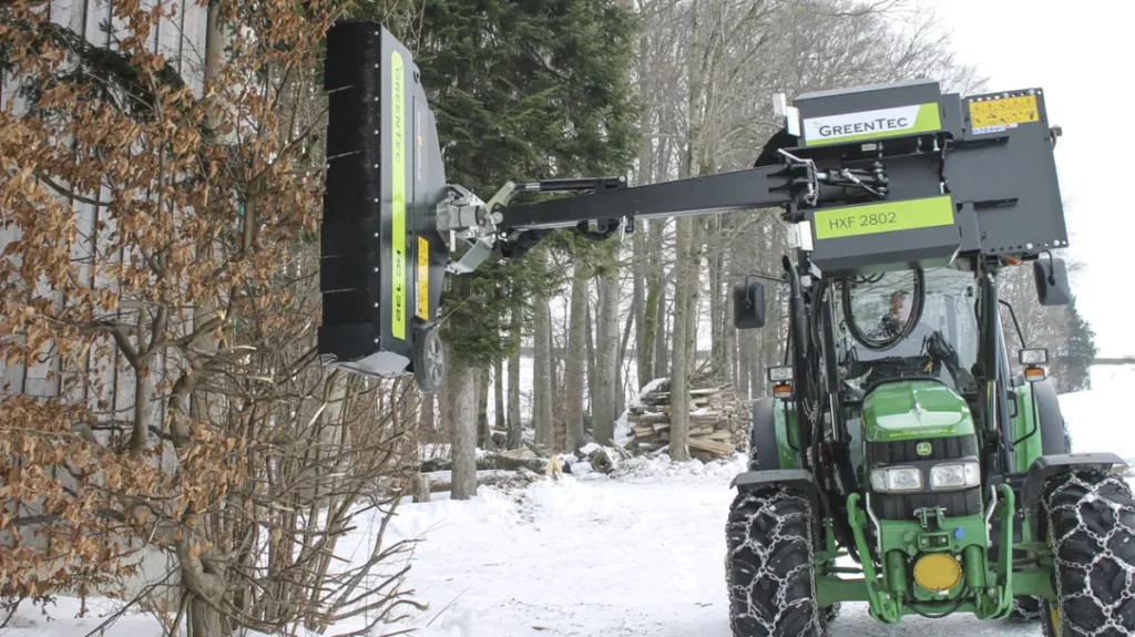 Hydraulic hedge trimmer mounted on a John Deere 5070M tractor