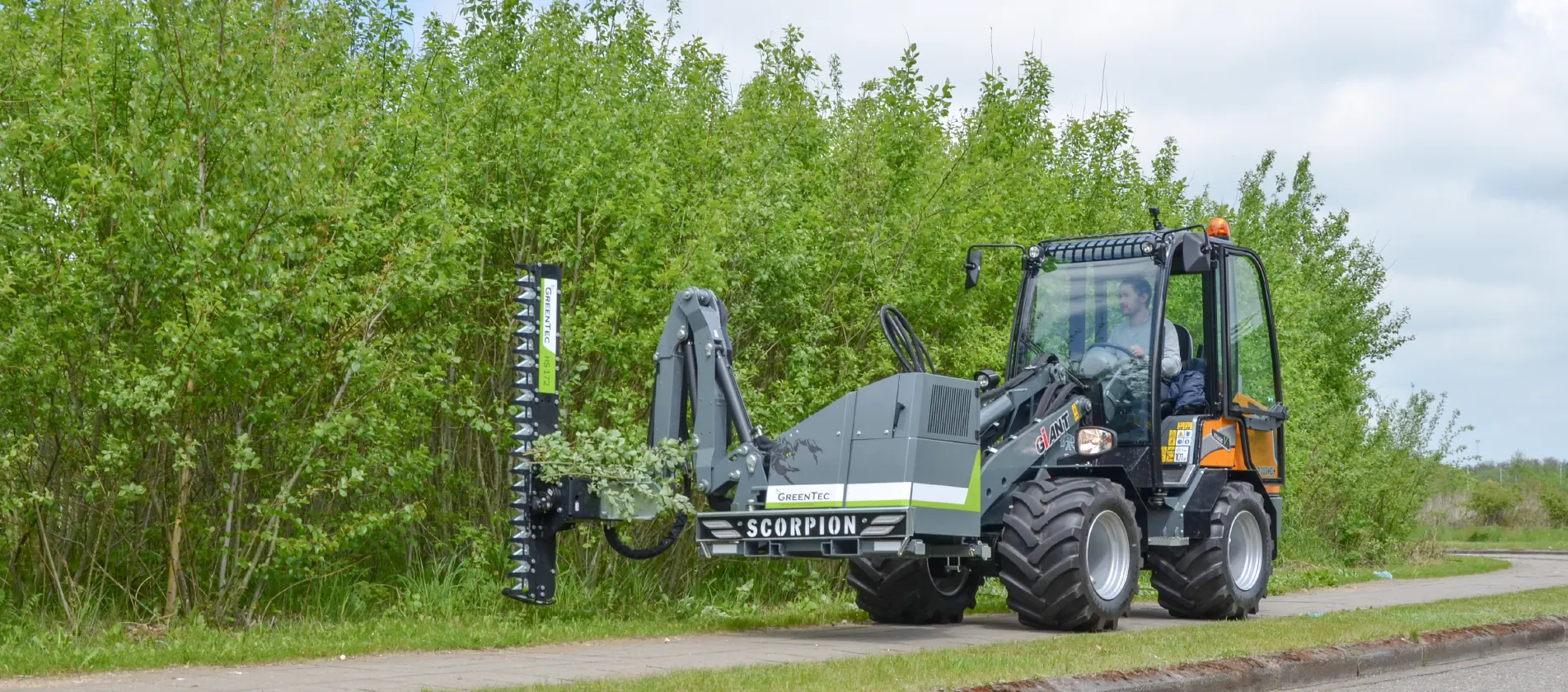 Hedge trimming attachment tool for skid steer loader