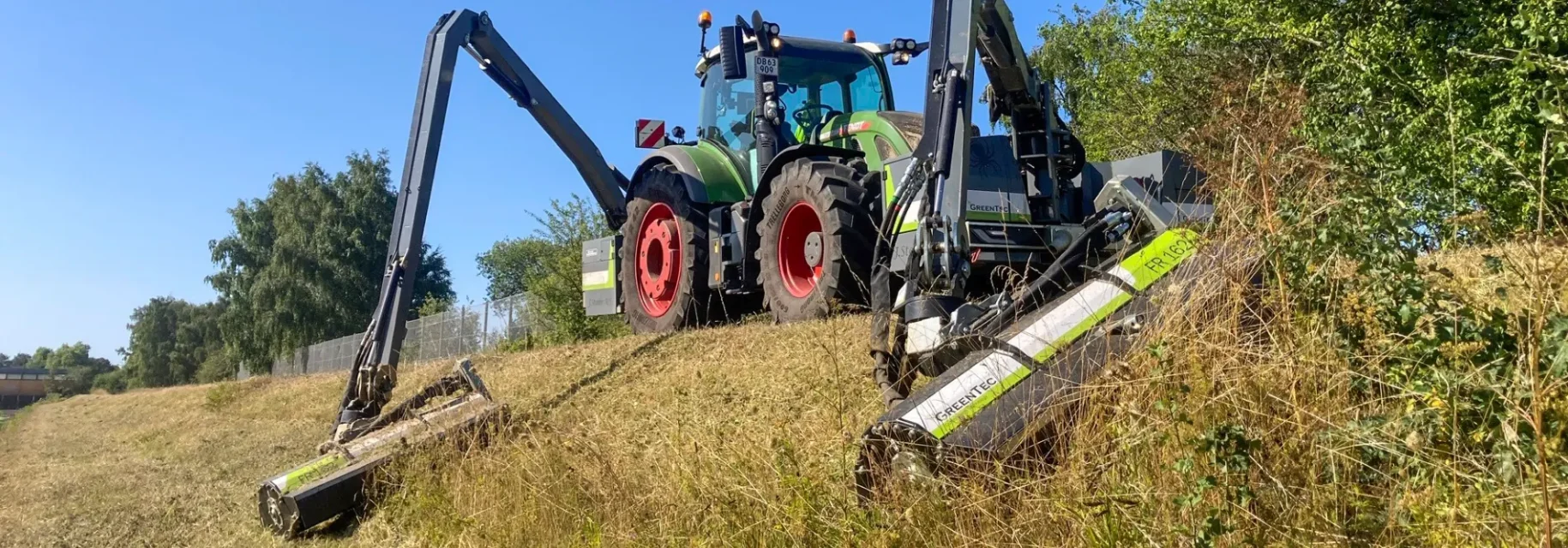 Front mounted boom mower for tractor