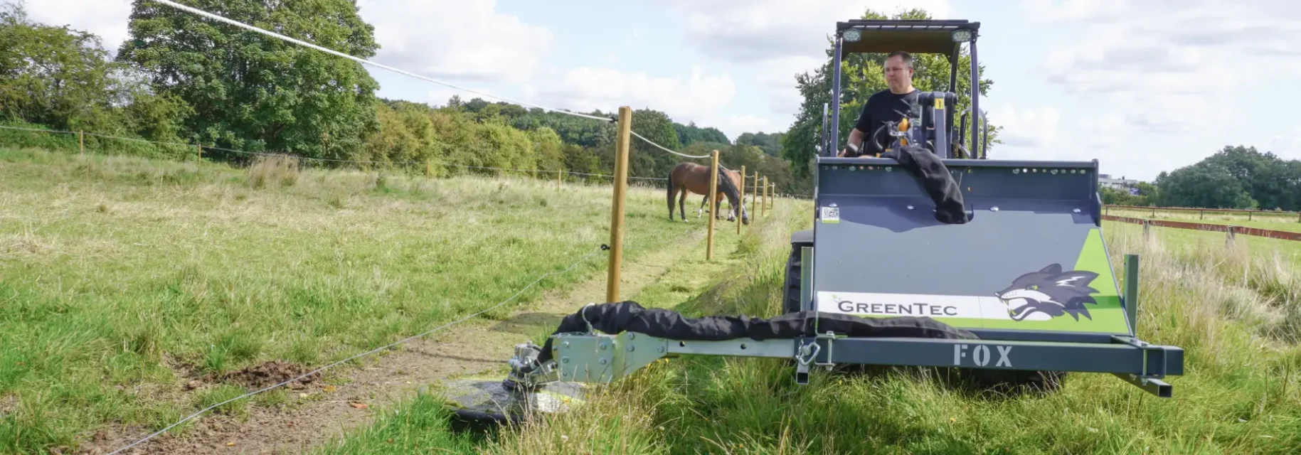 Fence line mower for skid steer
