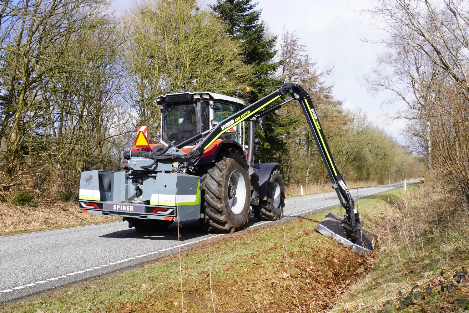 RX 133 mounted on a tractor with arm mower