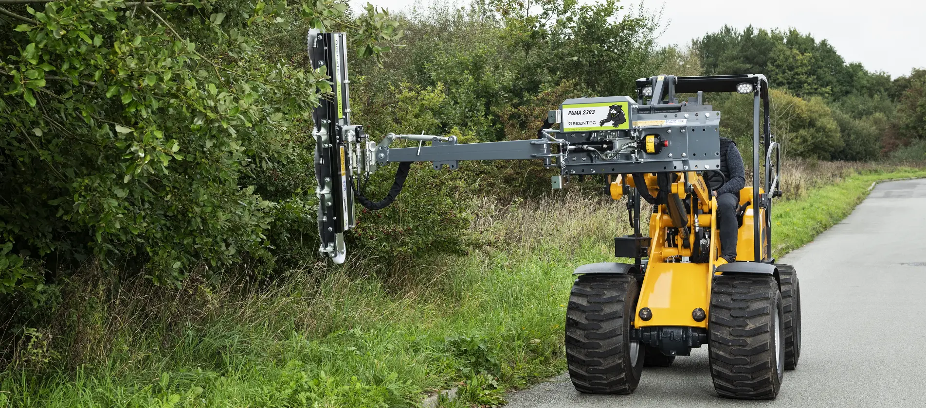 Tree trimming with skid steer loader