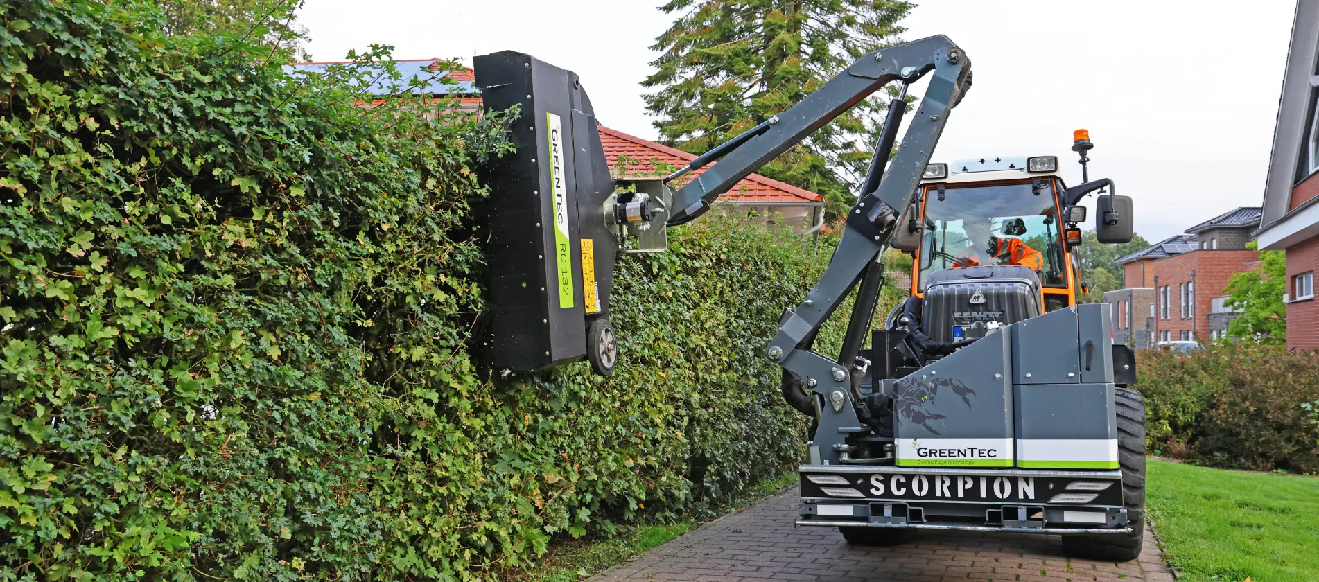 Vertical brush cutter mounted on small tractor
