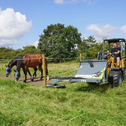 Mow grass under fences
