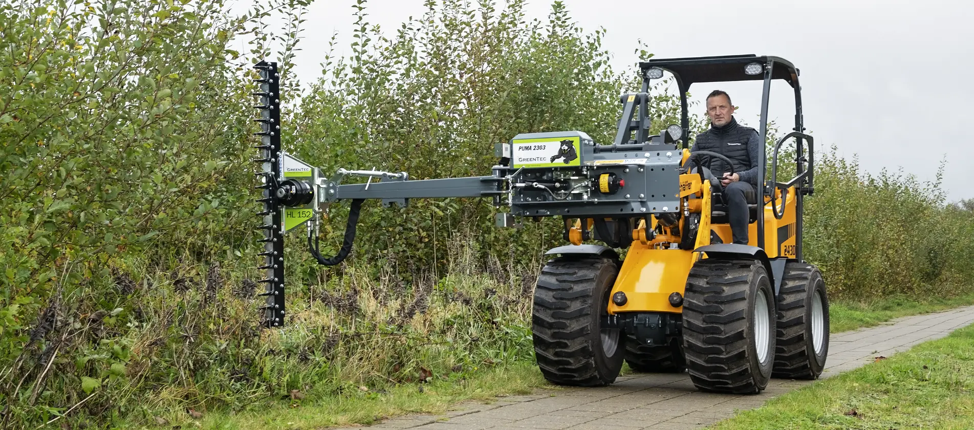 Hedge trimmer attachment frame for skid steer loader